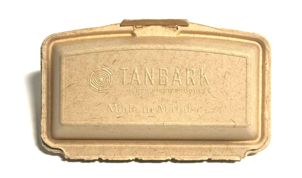 Tanbark Molded Fiber Products packaging on clear background